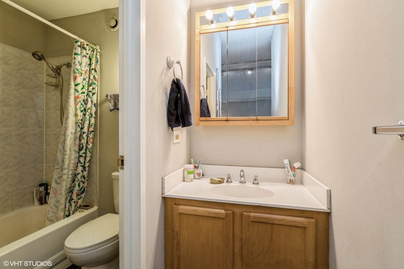 600 South Dearborn Street, Unit 1104 Chicago, IL 60605 - Photo 10 of 10 a bathroom with a sink a toilet and shower