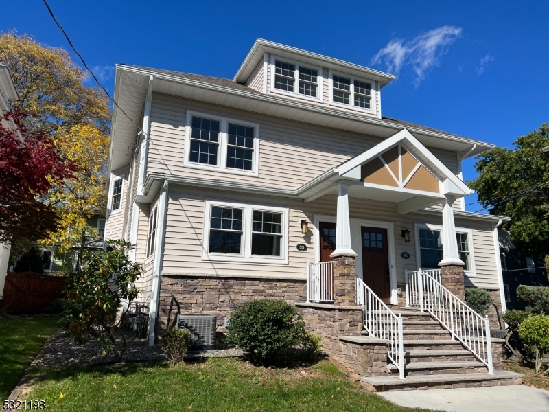 33 Morris Avenue Summit, NJ 07901 - Photo 1 of 28 a front view of a house with a yard