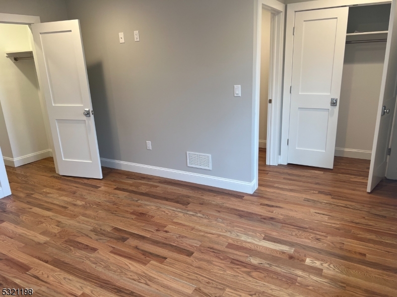 33 Morris Avenue Summit, NJ 07901 - Photo 13 of 28 a view of an empty room with wooden floor and a window