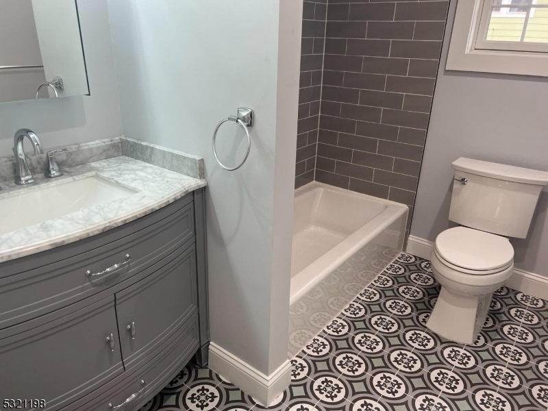 33 Morris Avenue Summit, NJ 07901 - Photo 16 of 28 a bathroom with a sink toilet and shower