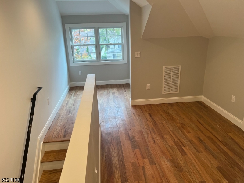 33 Morris Avenue Summit, NJ 07901 - Photo 19 of 28 wooden floor in an empty room with a window