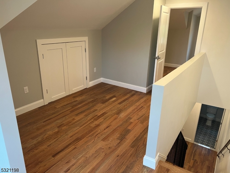 33 Morris Avenue Summit, NJ 07901 - Photo 20 of 28 a view of an empty room with wooden floor