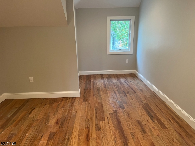 33 Morris Avenue Summit, NJ 07901 - Photo 22 of 28 an empty room with wooden floor and windows