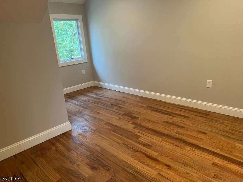 33 Morris Avenue Summit, NJ 07901 - Photo 23 of 28 an empty room with wooden floor and windows