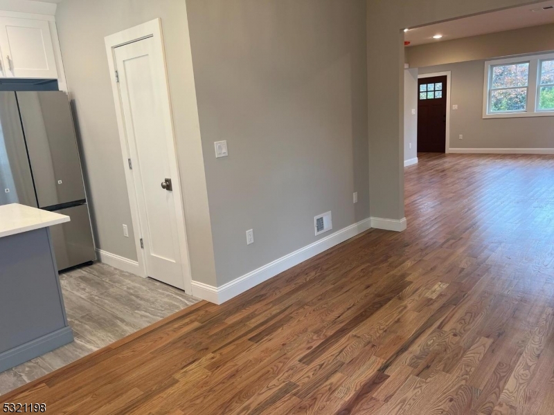 33 Morris Avenue Summit, NJ 07901 - Photo 8 of 28 an empty room with wooden floor and windows