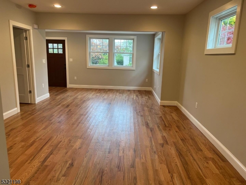 33 Morris Avenue Summit, NJ 07901 - Photo 10 of 28 an empty room with wooden floor and windows