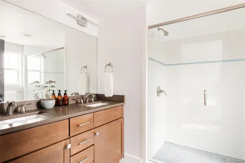 a kitchen with a sink and a mirror