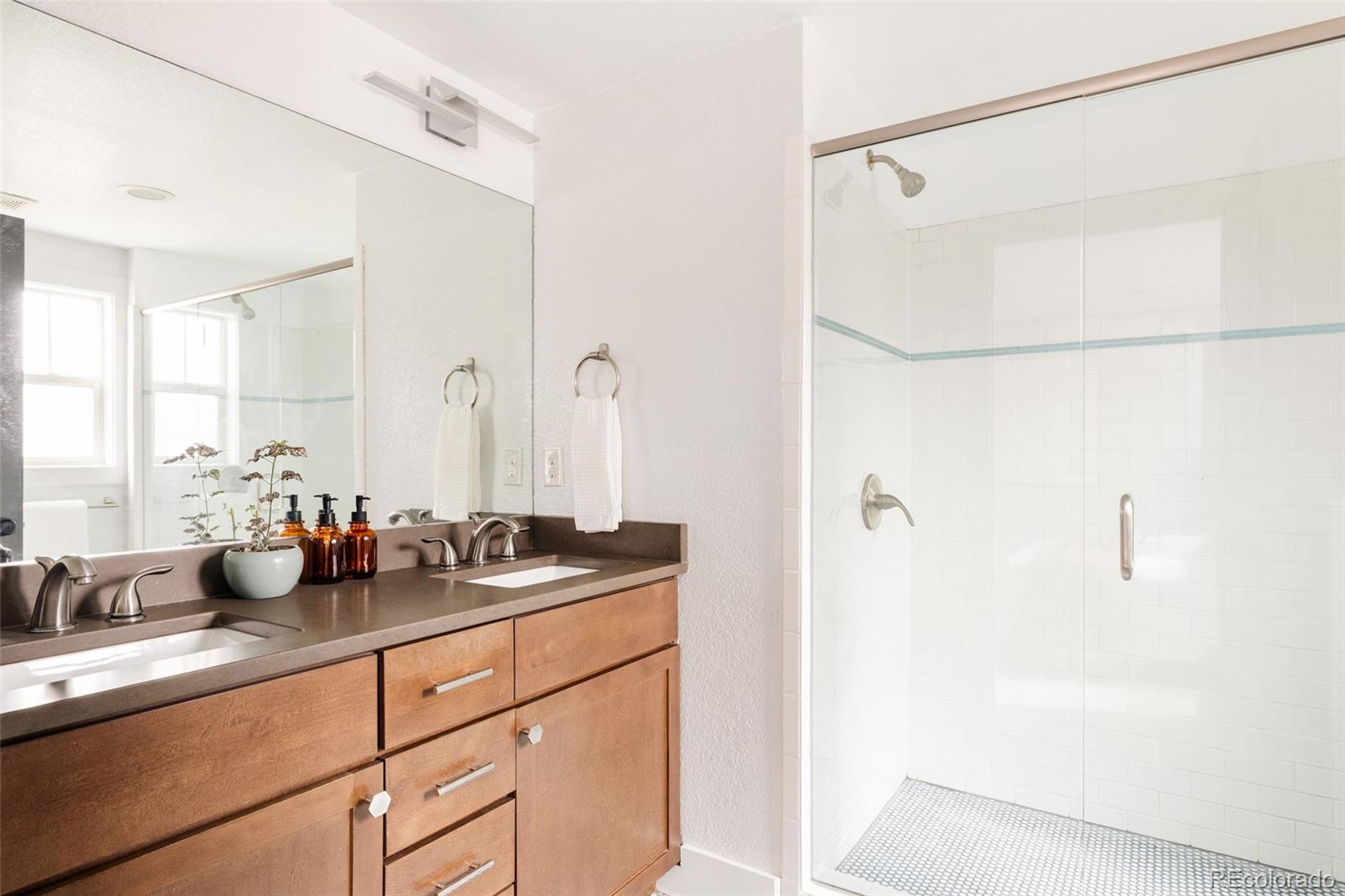 3100 North High Street Denver, CO 80205 - Photo 13 of 28 a kitchen with a sink and a mirror