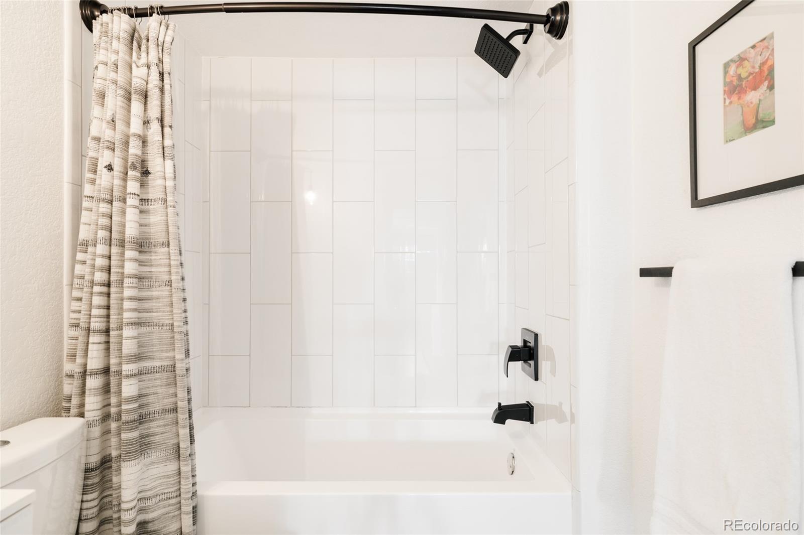 3100 North High Street Denver, CO 80205 - Photo 17 of 28 a bathroom with a bathtub