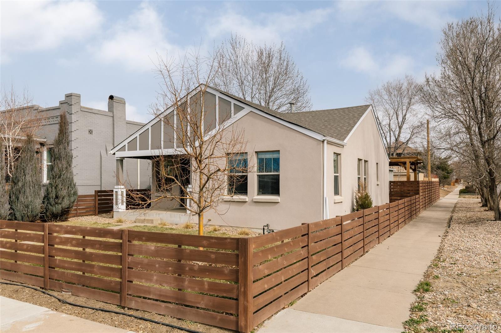 3100 North High Street Denver, CO 80205 - Photo 18 of 28 a front view of a house with large windows