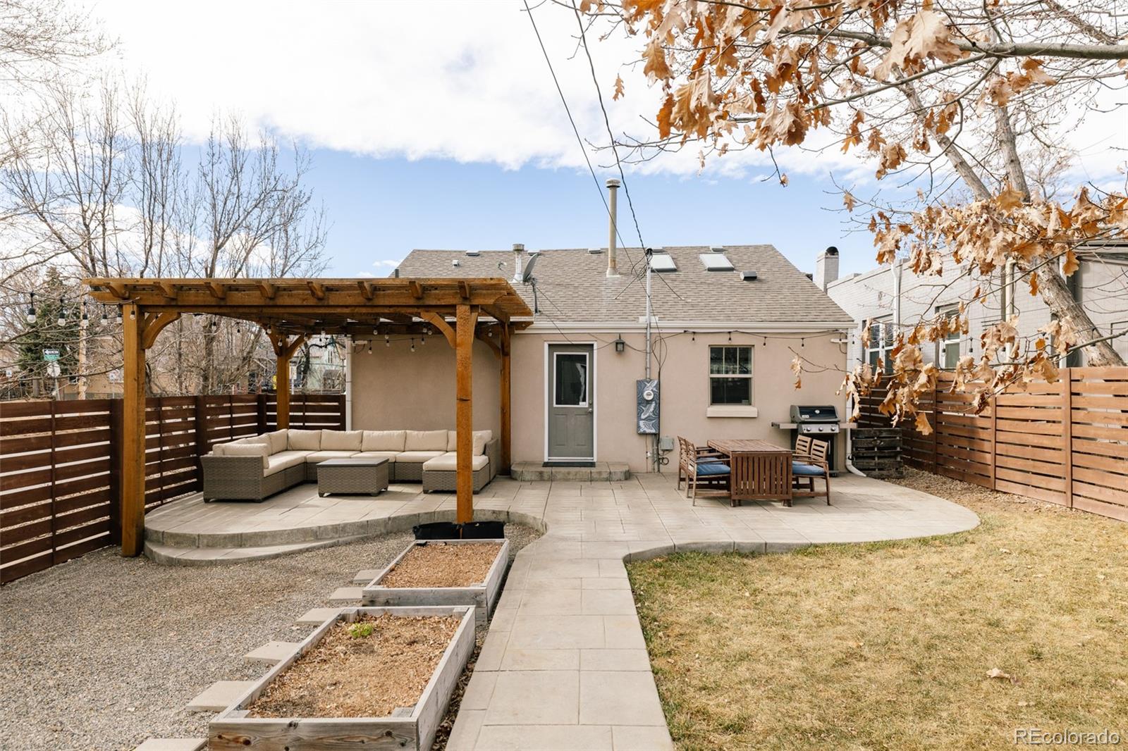 3100 North High Street Denver, CO 80205 - Photo 20 of 28 a front view of a house with patio