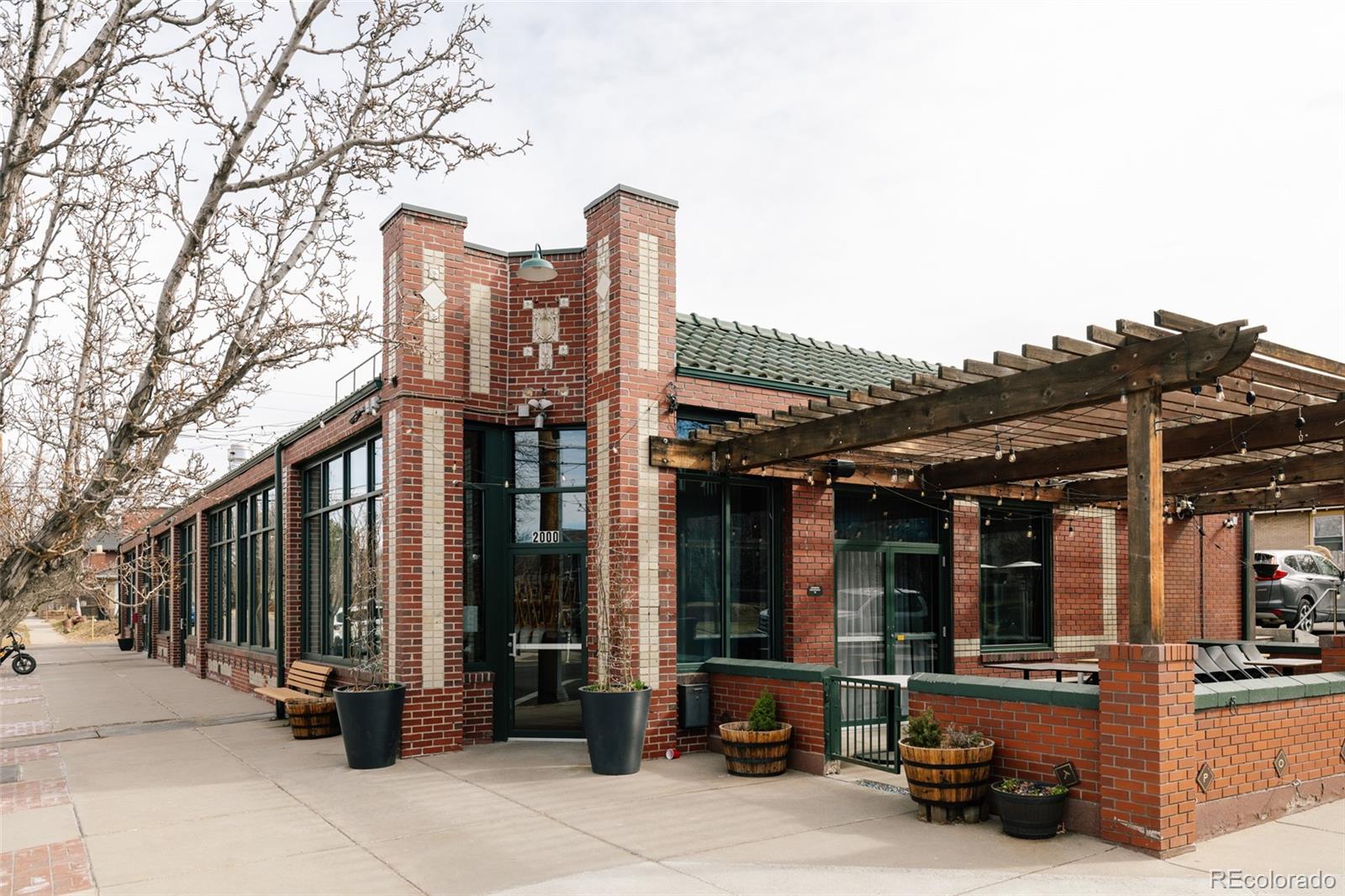 3100 North High Street Denver, CO 80205 - Photo 24 of 28 a car parked in front of a building