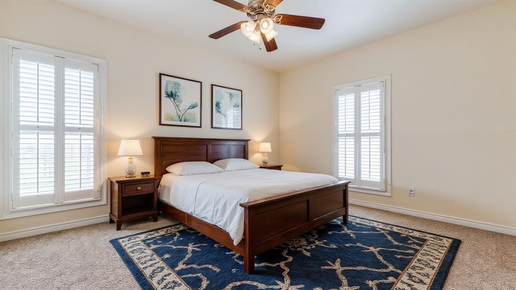 4034 Rawlins Street, Unit 102 Dallas, TX 75219 - Photo 19 of 24 a bedroom with a bed and window