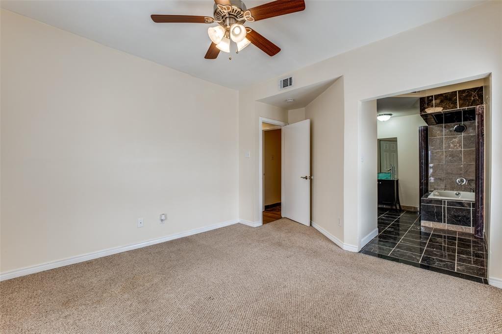 4034 Rawlins Street, Unit 102 Dallas, TX 75219 - Photo 20 of 24 wooden floor in an empty room