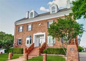 4034 Rawlins Street, Unit 102 Dallas, TX 75219 - Photo 22 of 24 a front view of a house with garden