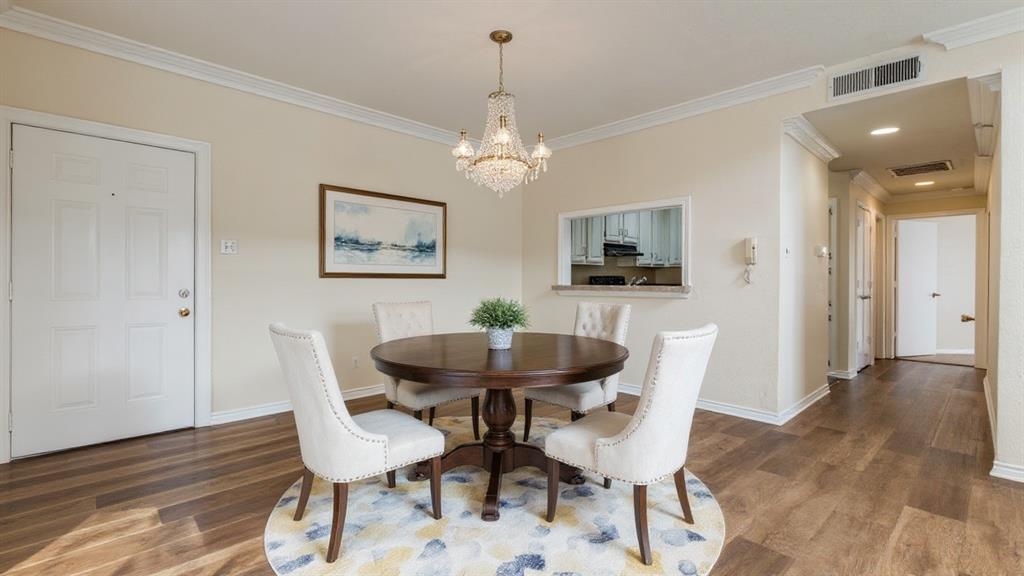 4034 Rawlins Street, Unit 102 Dallas, TX 75219 - Photo 24 of 24 a view of a dining room with furniture and wooden floor