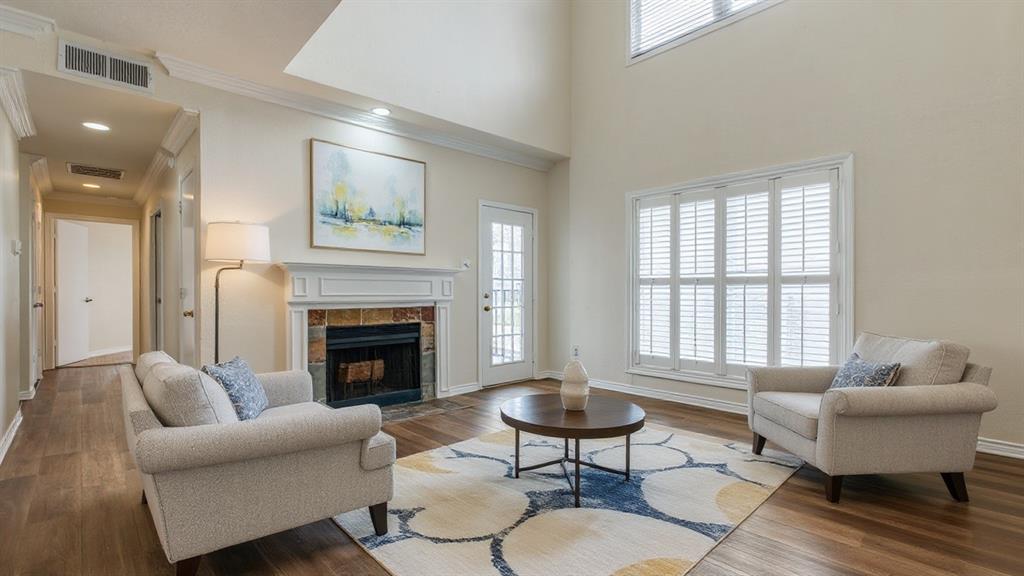4034 Rawlins Street, Unit 102 Dallas, TX 75219 - Photo 9 of 24 a living room with furniture fireplace and window