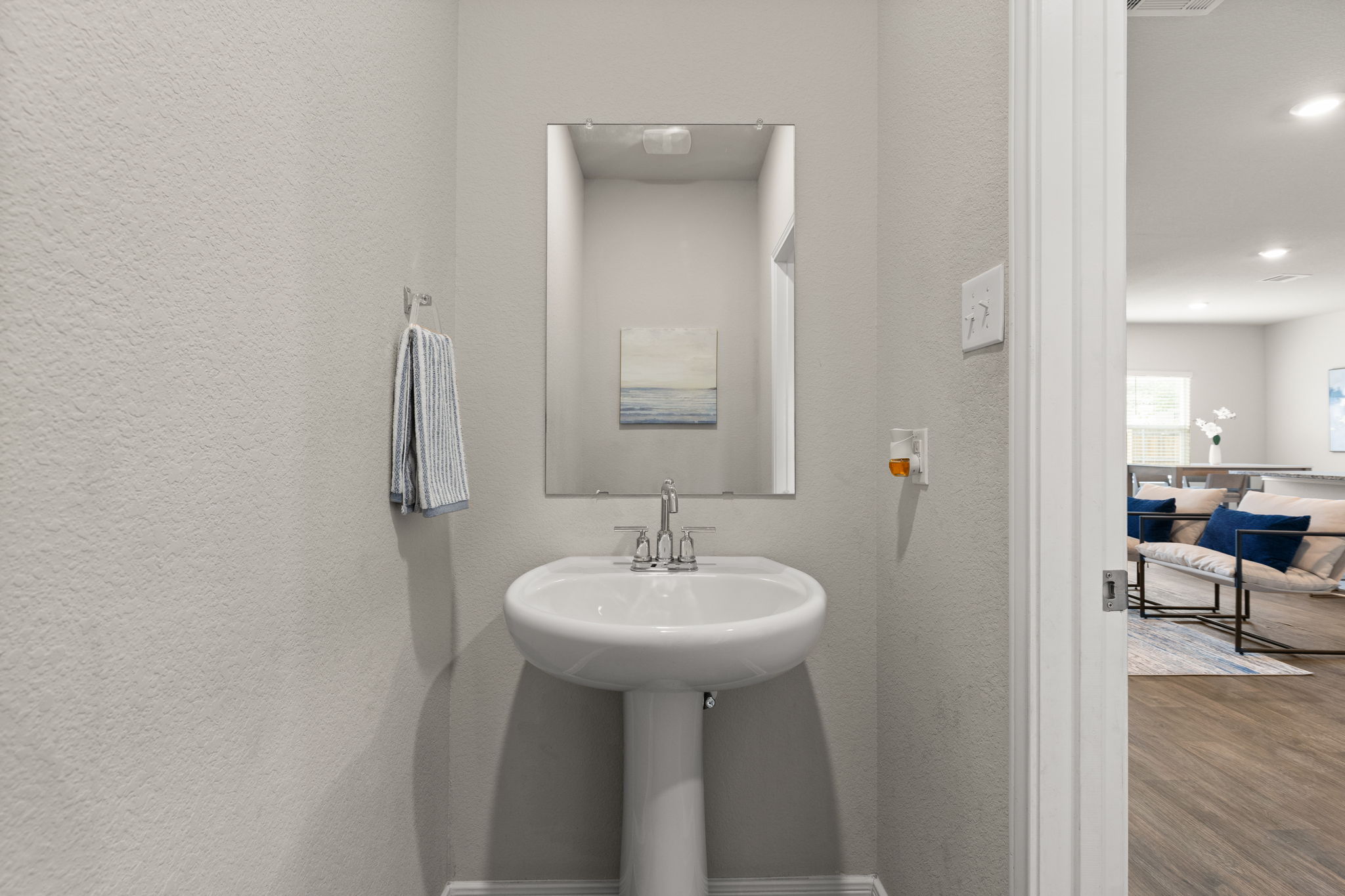 281 Jayden Drive Kyle, TX 78640 - Photo 18 of 36 Pedestal sink with chrome-finish faucet and rectangular mirror