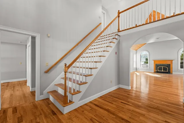 a view of an entryway with wooden floor