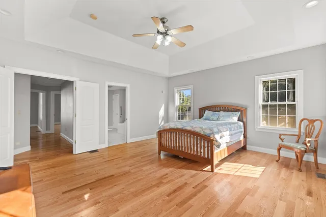 a bedroom with a bed and a chair