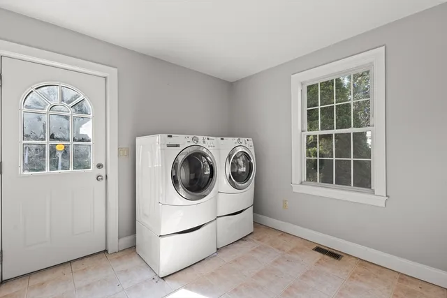a utility room with dryer and washer