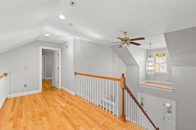 a view of a room with wooden floor and stairs
