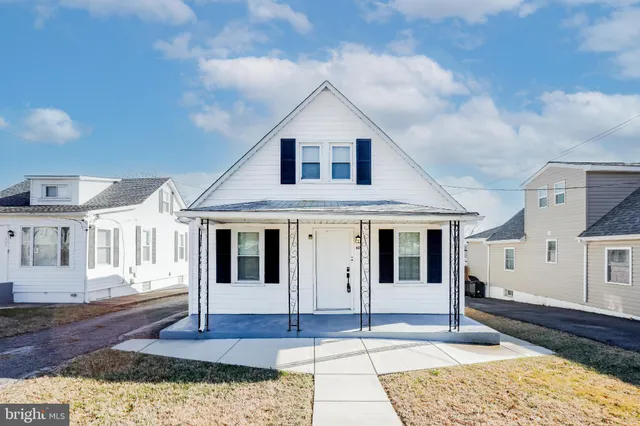 a front view of a house with a porch