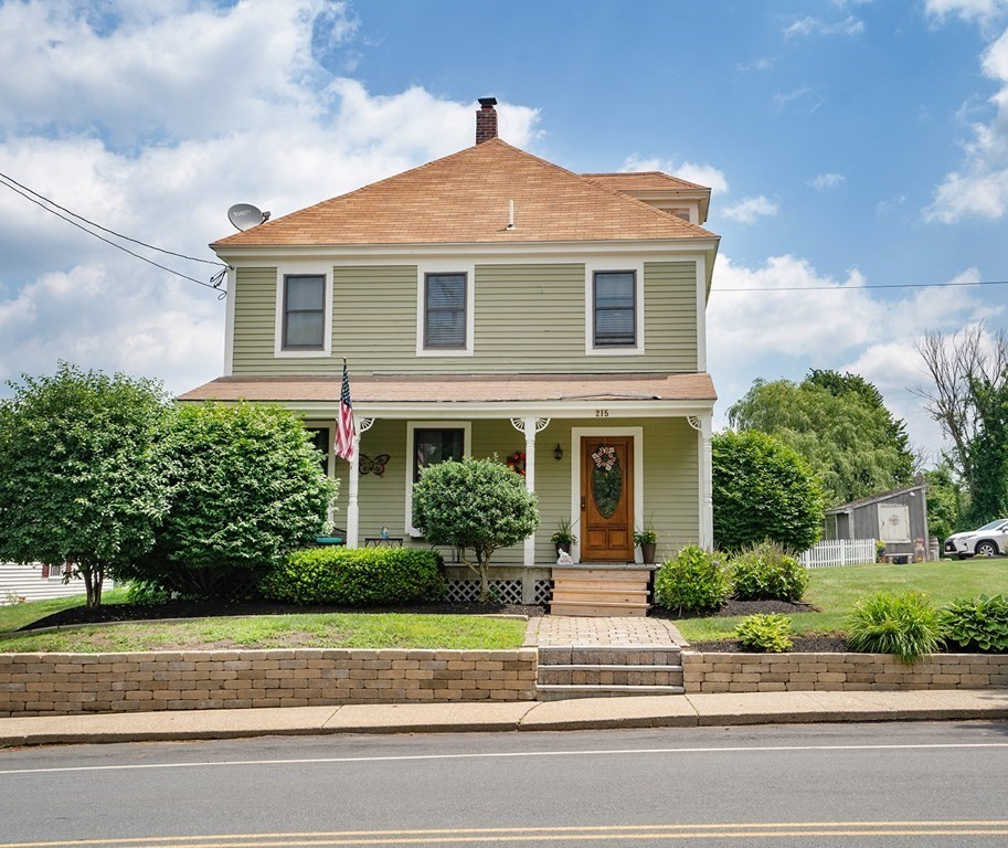 215 Market Street Amesbury, MA 01913 - Photo 1 of 41 a front view of a house with a yard