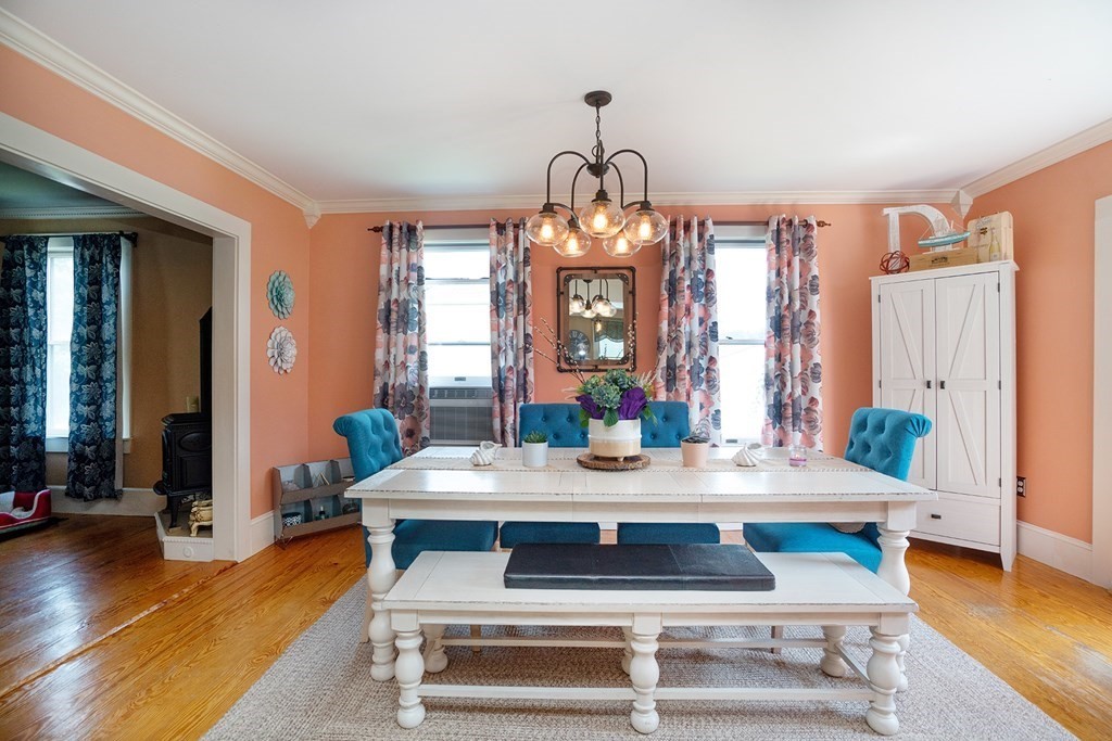 215 Market Street Amesbury, MA 01913 - Photo 11 of 41 a view of a dining room with furniture window and wooden floor