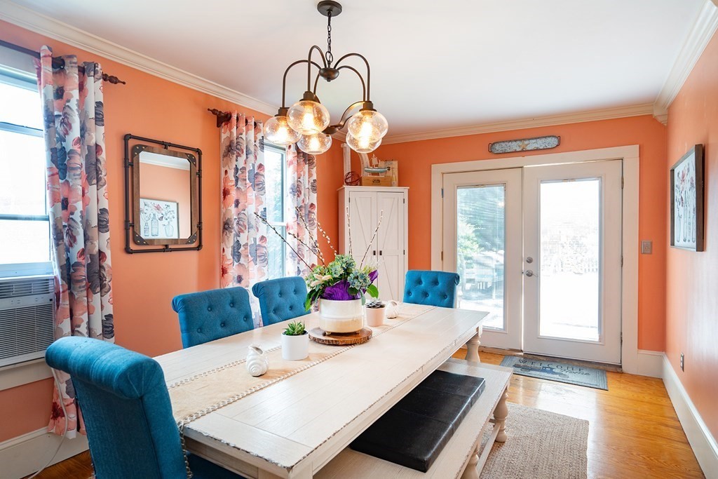 215 Market Street Amesbury, MA 01913 - Photo 12 of 41 a view of a dining room with furniture window and wooden floor