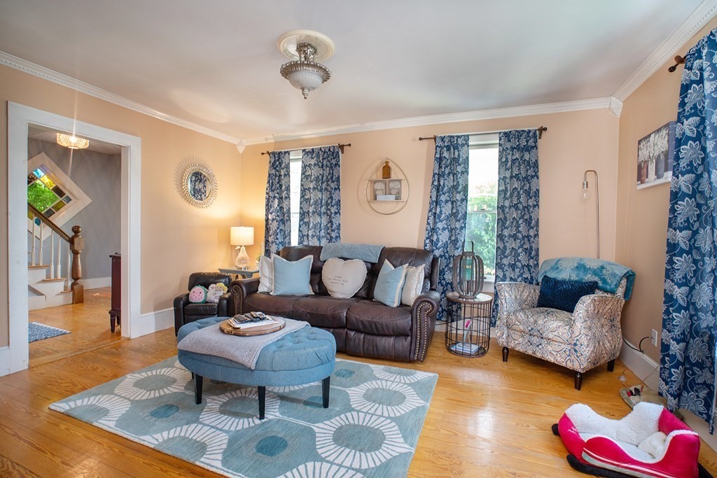 215 Market Street Amesbury, MA 01913 - Photo 13 of 41 a living room with furniture and a large window
