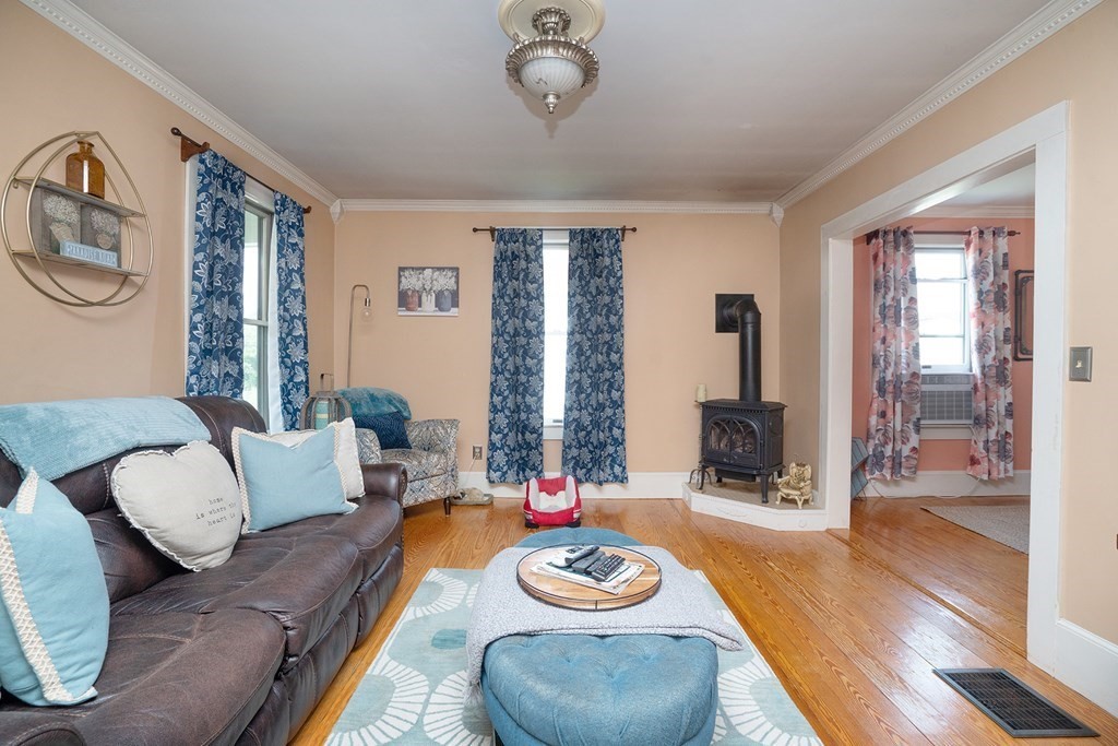 215 Market Street Amesbury, MA 01913 - Photo 14 of 41 a living room with furniture and a wooden floor