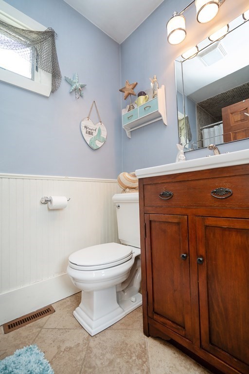215 Market Street Amesbury, MA 01913 - Photo 17 of 41 a bathroom with a toilet a sink and a mirror