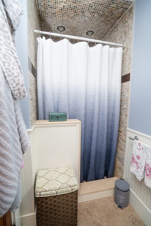 215 Market Street Amesbury, MA 01913 - Photo 18 of 41 a bathroom with a shower curtain and a sink