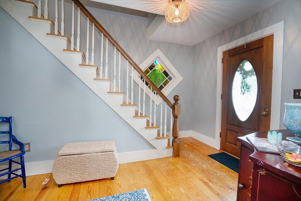 215 Market Street Amesbury, MA 01913 - Photo 19 of 41 a view of a hallway with wooden floor and staircase