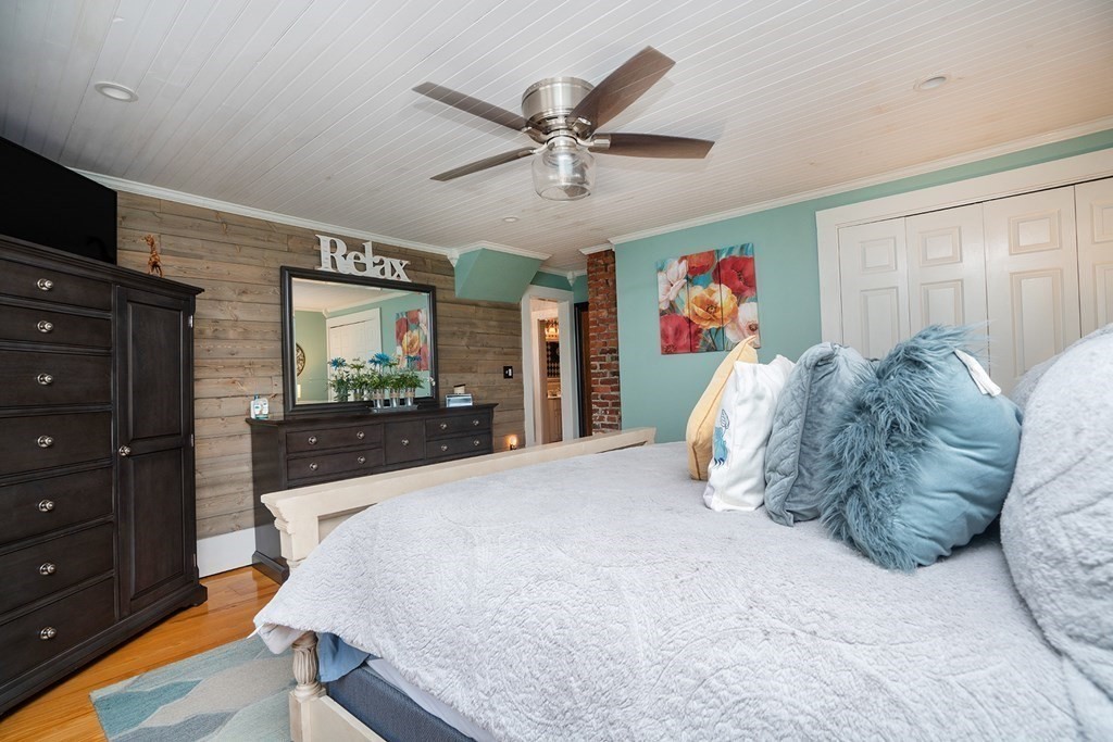 215 Market Street Amesbury, MA 01913 - Photo 22 of 41 a bed room with a bed mirror and a window