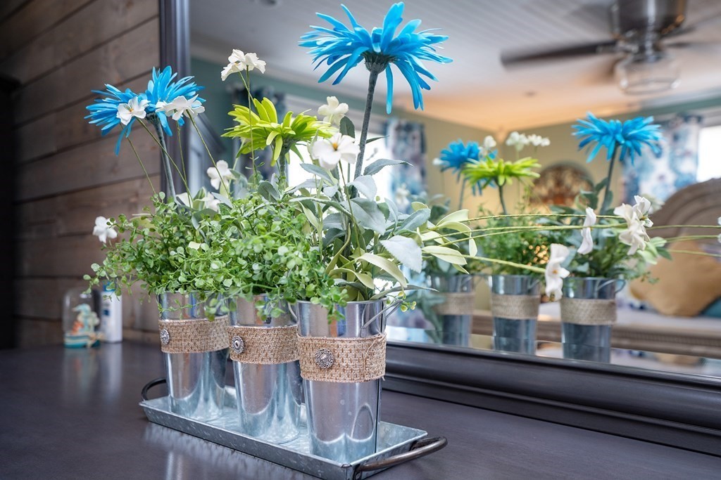 215 Market Street Amesbury, MA 01913 - Photo 24 of 41 a view of a vase of flowers sitting on a table with window