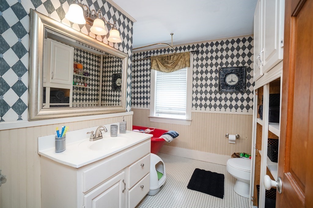 215 Market Street Amesbury, MA 01913 - Photo 25 of 41 a bathroom with a sink and a mirror