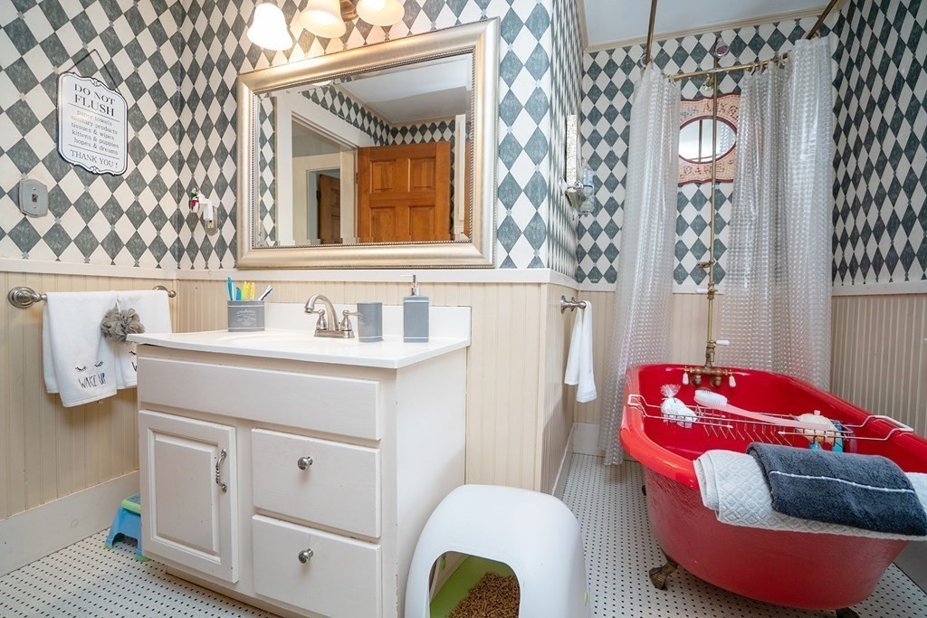 215 Market Street Amesbury, MA 01913 - Photo 26 of 41 a bathroom with a sink and a mirror
