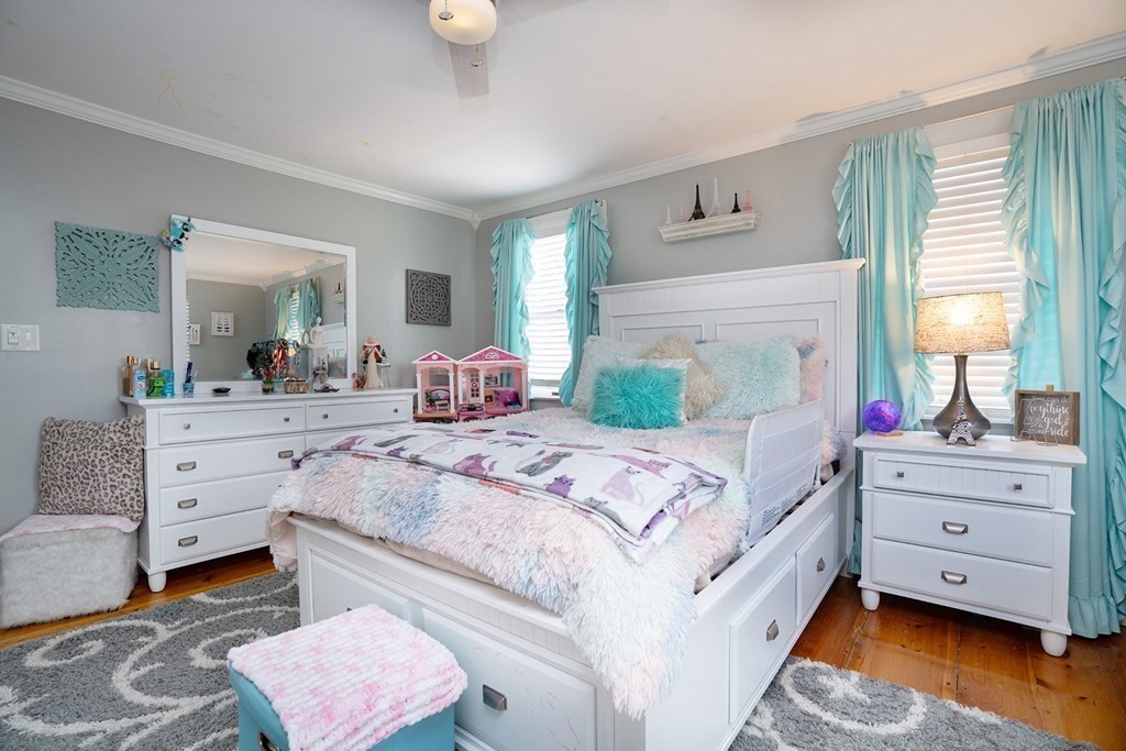 215 Market Street Amesbury, MA 01913 - Photo 29 of 41 a bedroom with a bed and window