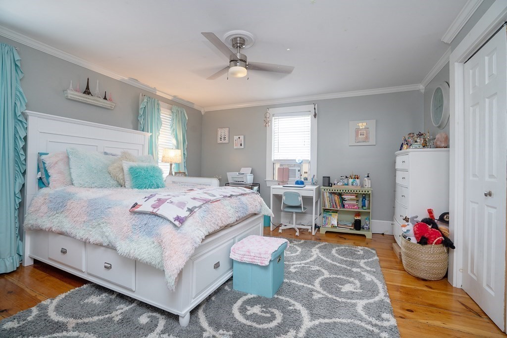 215 Market Street Amesbury, MA 01913 - Photo 30 of 41 a bedroom with a bed couch and a window