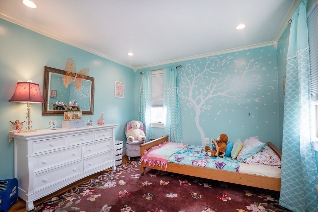 215 Market Street Amesbury, MA 01913 - Photo 31 of 41 a bed room with a bed and a dresser