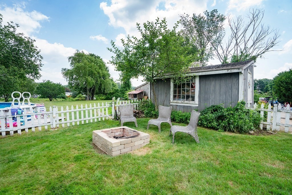 215 Market Street Amesbury, MA 01913 - Photo 35 of 41 a view of a chair and table in backyard of the house