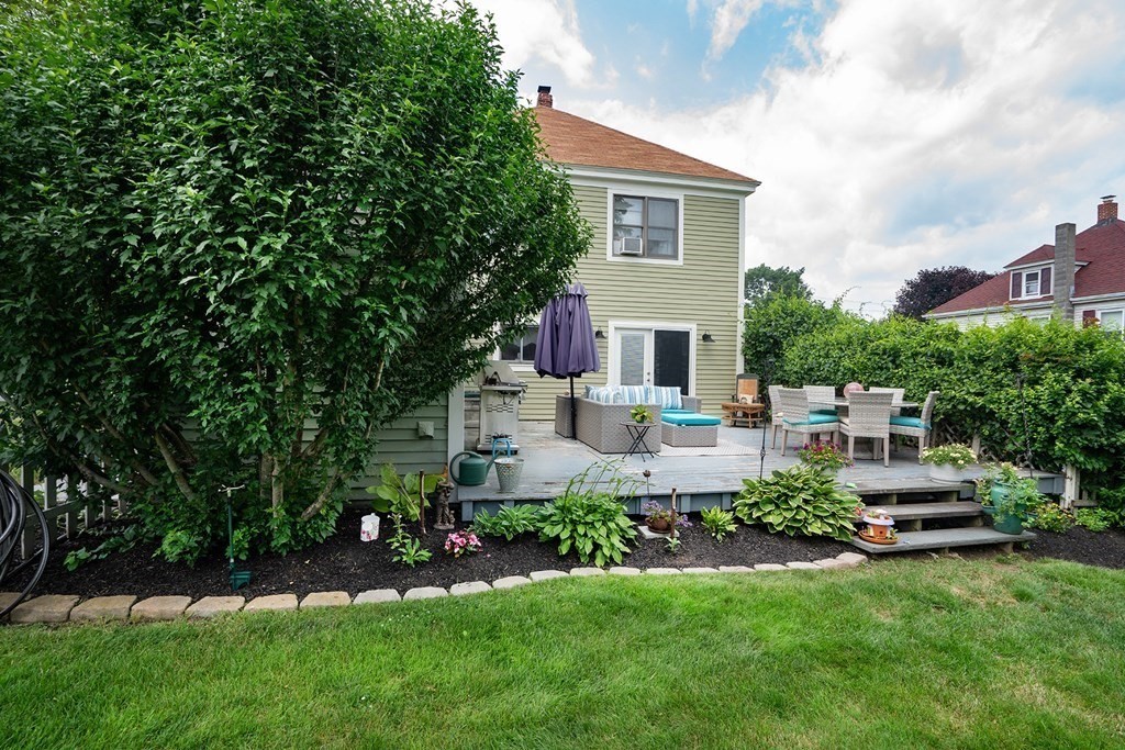 215 Market Street Amesbury, MA 01913 - Photo 37 of 41 a view of a house with backyard sitting area and garden