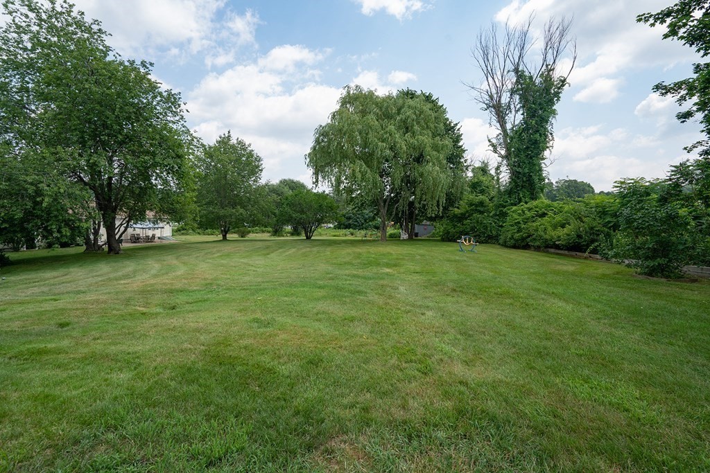 215 Market Street Amesbury, MA 01913 - Photo 40 of 41 a view of a grassy field with trees
