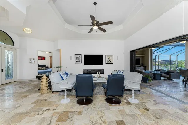 a kitchen with granite countertop white cabinets and stainless steel appliances