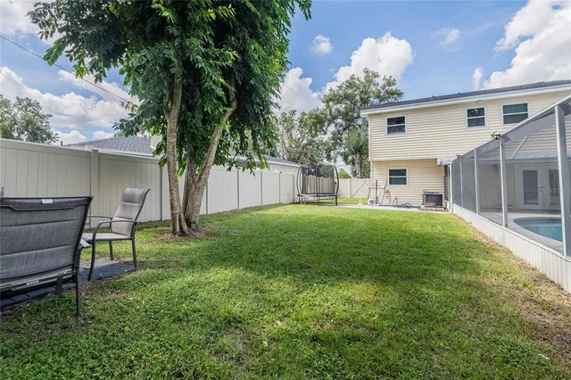 a house view with a sitting space and garden