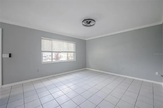 a view of an empty room and window
