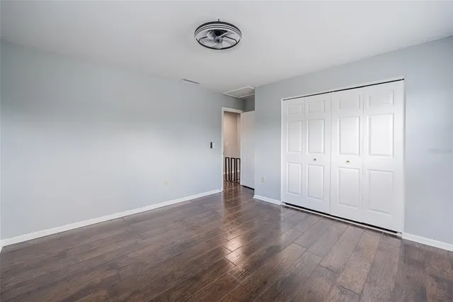a view of a room with wooden floor