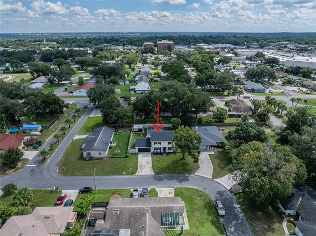 an aerial view of a house with a garden